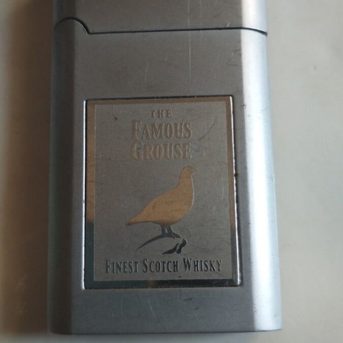 Famous Grouse lighter used, no gas
