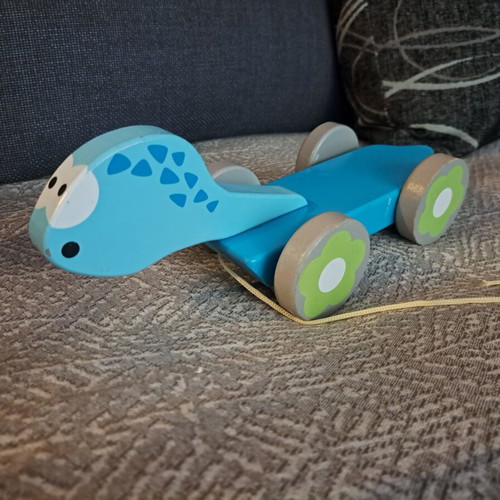 Wooden Dinosaur Pull Toy by J'adore like new, blue with floral wheels
