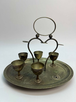 Vintage brass egg cup set with base and handle used