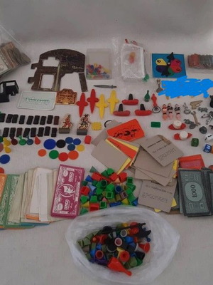 Lot of used game pieces, cards, and play money