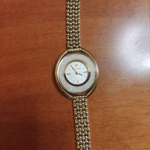 Swarovski women's gold-plated watch used
