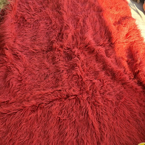 Red wool flokati rug