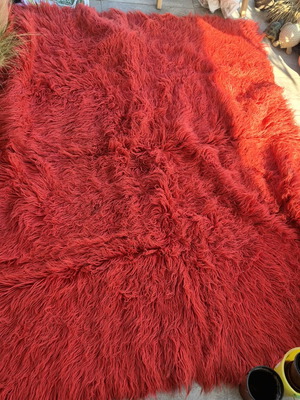 Red wool flokati rug