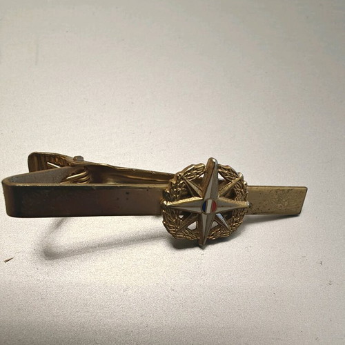 Collectible tie clip used, gold color with French security emblem