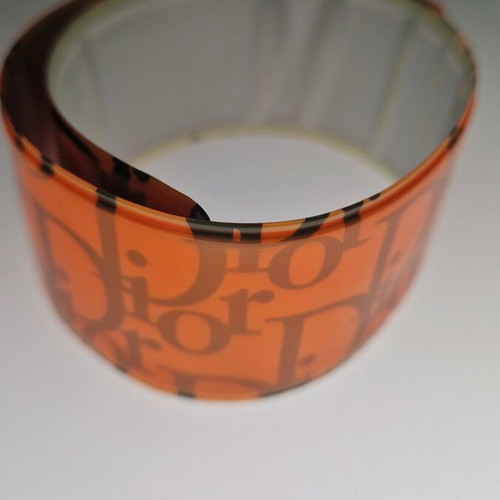 Dior foldable bracelet neon orange used