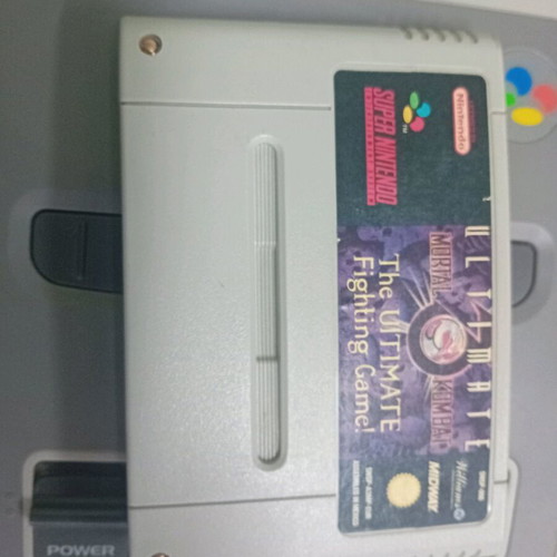 Super Nintendo 1990 console with 2 controllers and 3 games