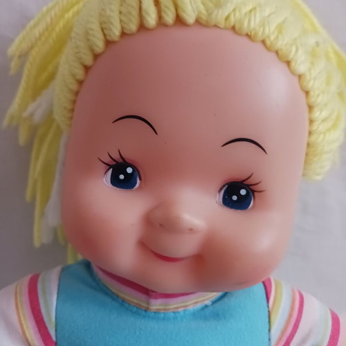 Doll with blonde yarn hair like new, soft body