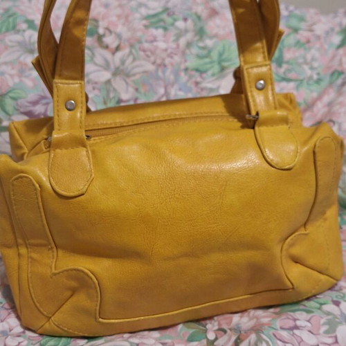 Women's mustard small hand bag used