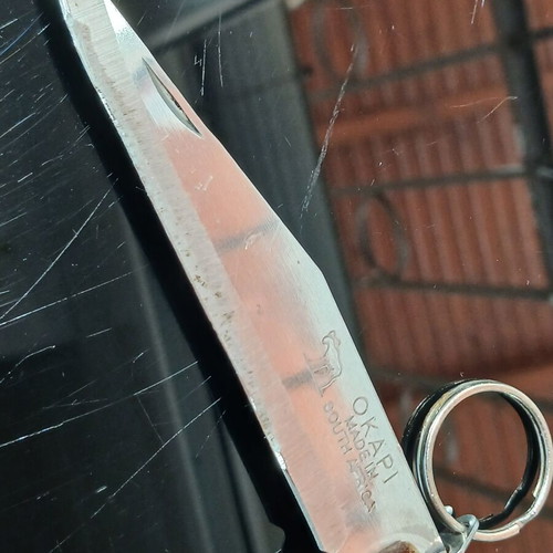 Okapi pocket knife used, carbon steel blade, wooden handle