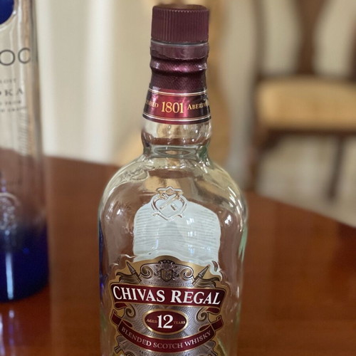 Empty premium liquor bottles and cocktail shaker like new