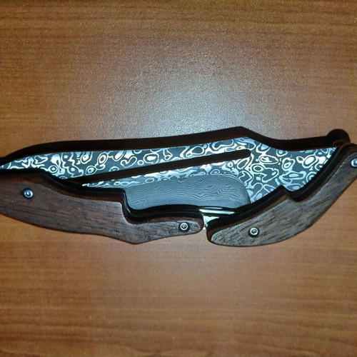 Folding knife with opening mechanism and Laser Pattern Damascus blade, like new