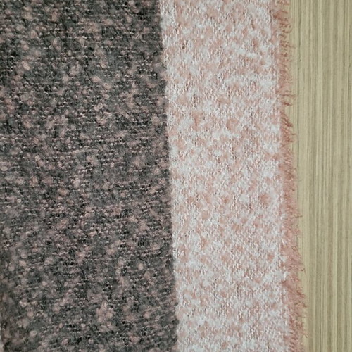 Winter scarf used in pink and gray shades with fringes