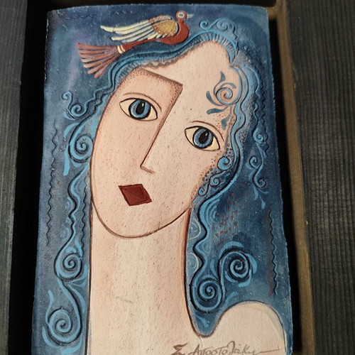 Vintage ceramic tile portrait of a woman with wooden frame used