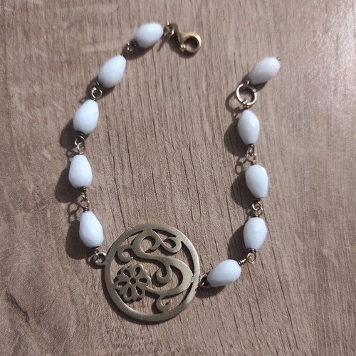 Silver bracelet new with white beads and metal detail