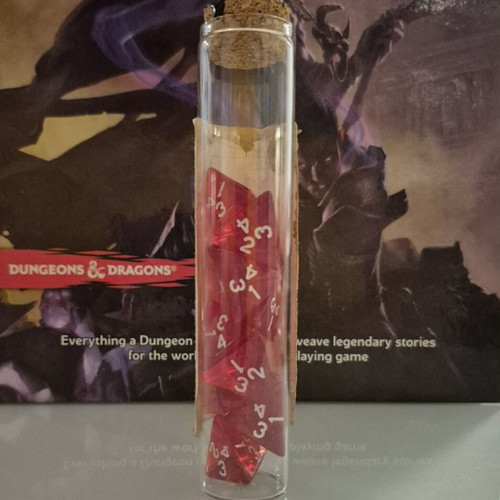 Dnd healing potion with 10 red tetrahedral dice in bottle