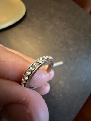 Zirgon eternity ring size 56 used, silver color, missing one zirgon