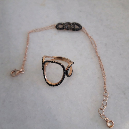 Silver set used with ring and black bracelet