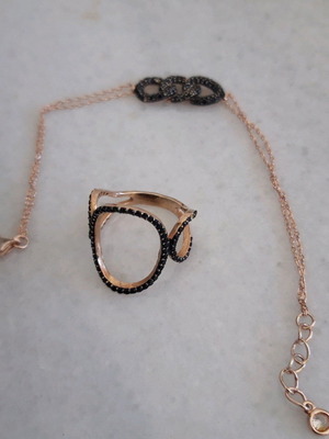 Silver set used with ring and black bracelet