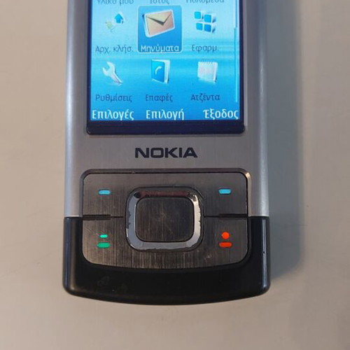 Nokia 6500 Slide phone like new with original charger, silver/black