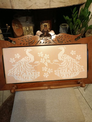 Handmade carved frame with crocheted peacocks design