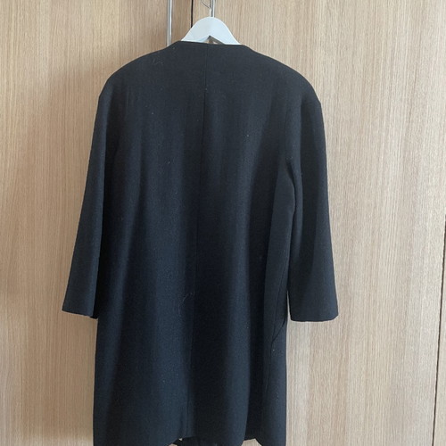 Black coat used with wool by Carling