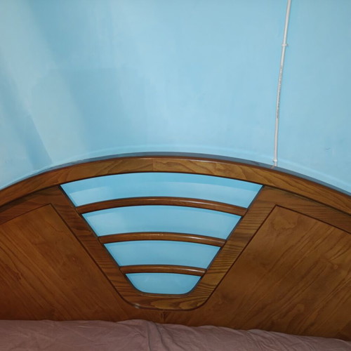 Wooden double bed frame with carved headboard, no mattress