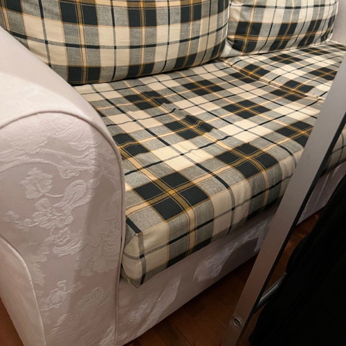 Two-seater sofa bed new with embossed beige cover
