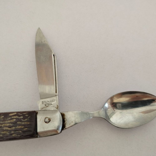 Vintage pocket knife with integrated fork and spoon, used