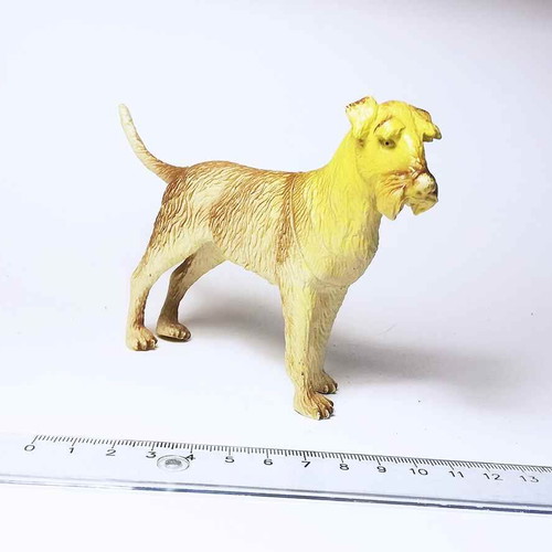 Dog plastic figure used with scratches and marks