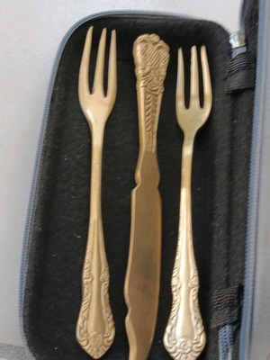 Set of brass fruit forks and ornate baroque knife early 1900s