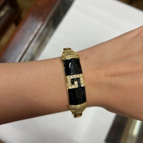 Bracelet like new with black and gold design