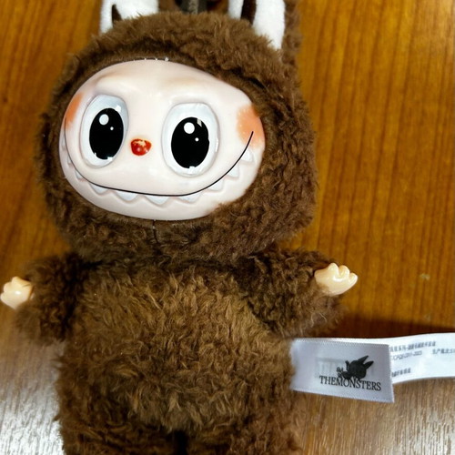 Labubu used brown figure from Pop Mart Monsters series