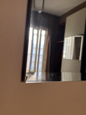 Mirror with corner damage