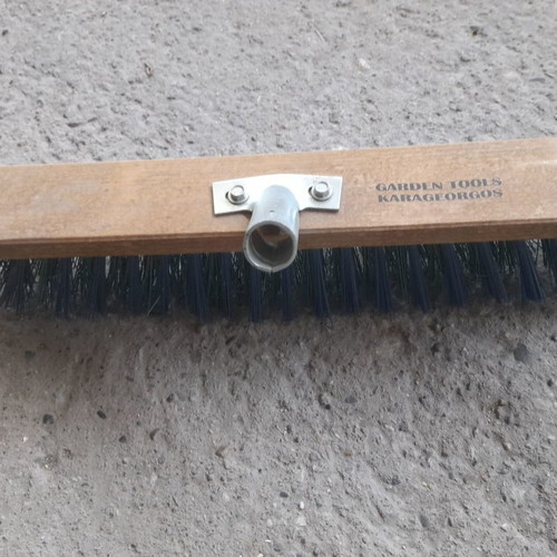 Street brush new with stiff bristles and metal handle