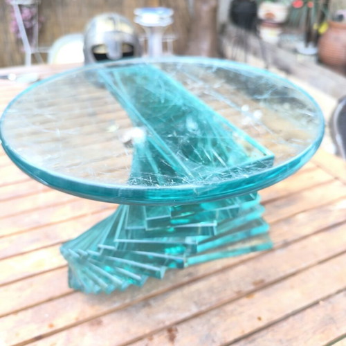 Round coffee table used with glass spiral base