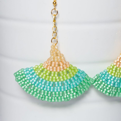 Handmade earrings with green and orange glass beads
