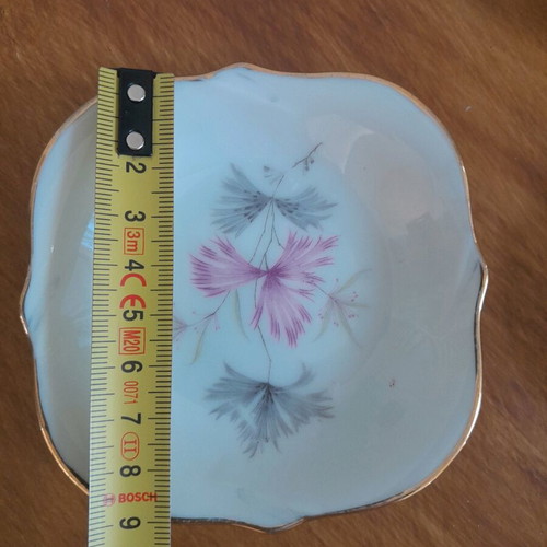 Porcelain plates and miniature bowls, old unused