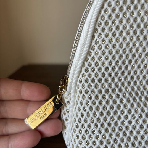 Guerlain toiletry bag, white and gold
