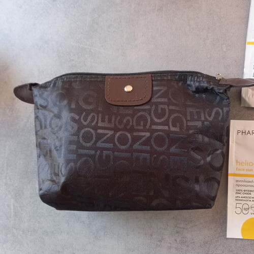 Makeup bag with new sunscreen samples CeraVe Pharmasept Heliocare