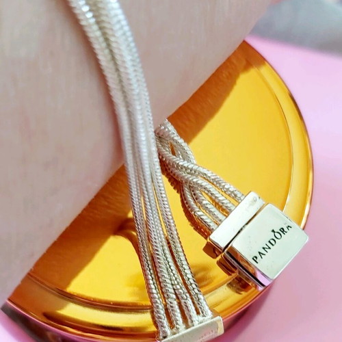 Pandora s925Ale Reflexions bracelet with four strands.