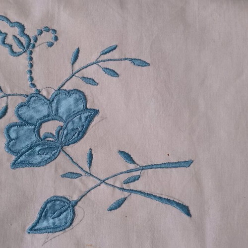 Vintage cotton bed sheets with blue satin appliqué pattern and pillowcases like new