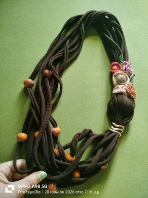 Handmade boho necklace with fabric and ceramic elements like new