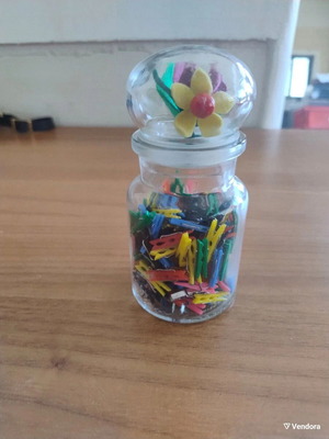 Storage jar with small clothespins for crafts