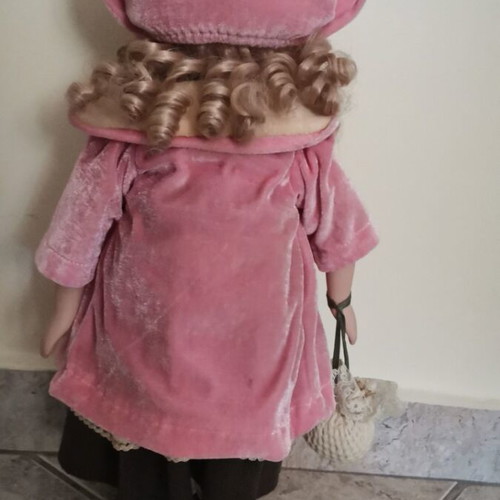 Collectible doll with coat and handbag like new