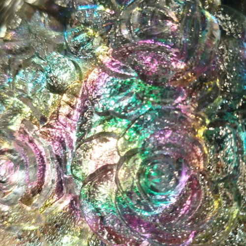 Vintage iridescent glass plate with embossed rose design