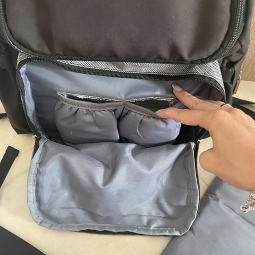 Baby bag with thermos holder and changing mat used