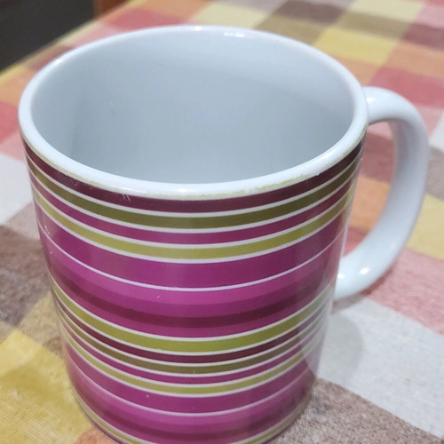 Coffee mugs used, set of 4 with designs and Nava brand