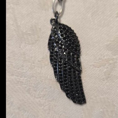 Modern necklace with black chain and angel wing pendant with rhinestones