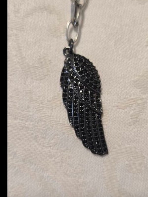 Modern necklace with black chain and angel wing pendant with rhinestones