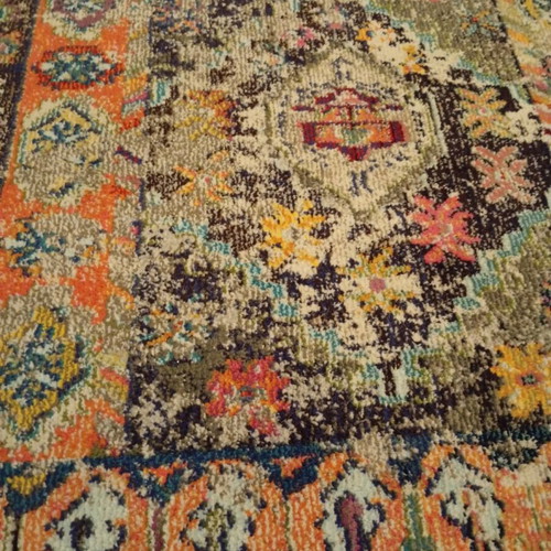 Colorful oriental style rug with distressed look like new